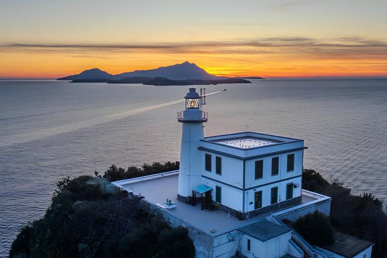 Sunset and full moon at the Miseno lighthouse